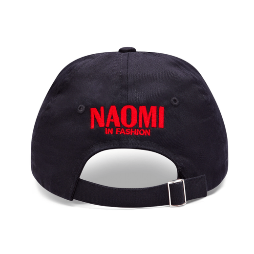 The back of a black baseball cap with the text 'Naomi In Fashion' embroidered in bright red letters.